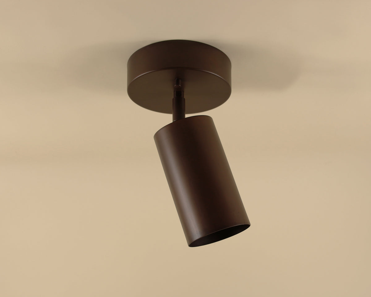 Modern ceiling light fixture on a beige background