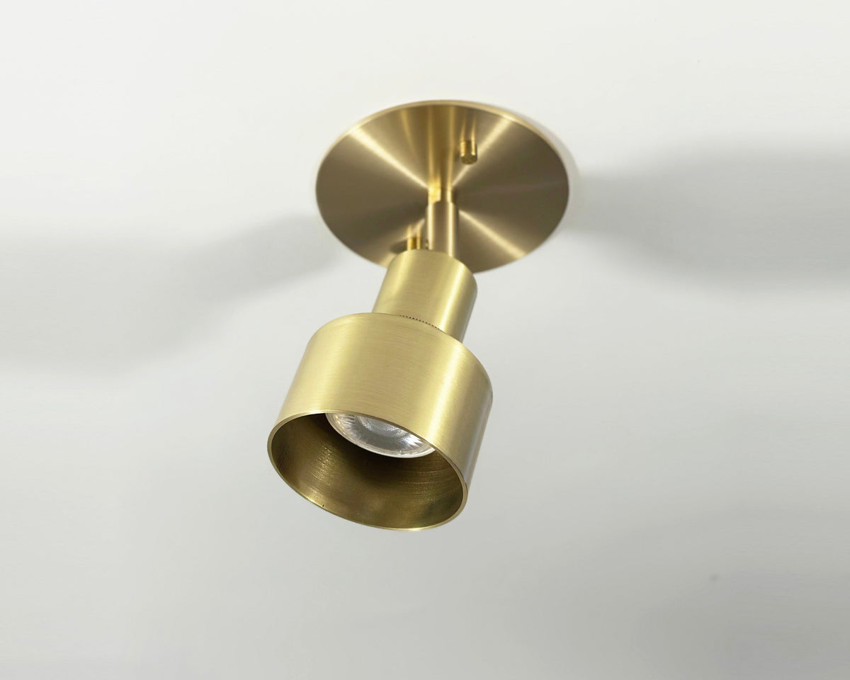 Gold ceiling light fixture on a white background