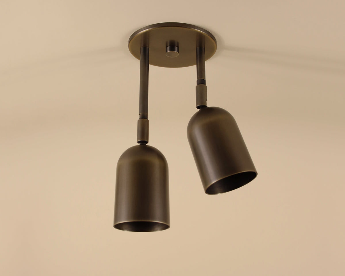 Bronze ceiling light fixture on a beige background