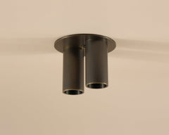 brass light fixture on a beige ceiling