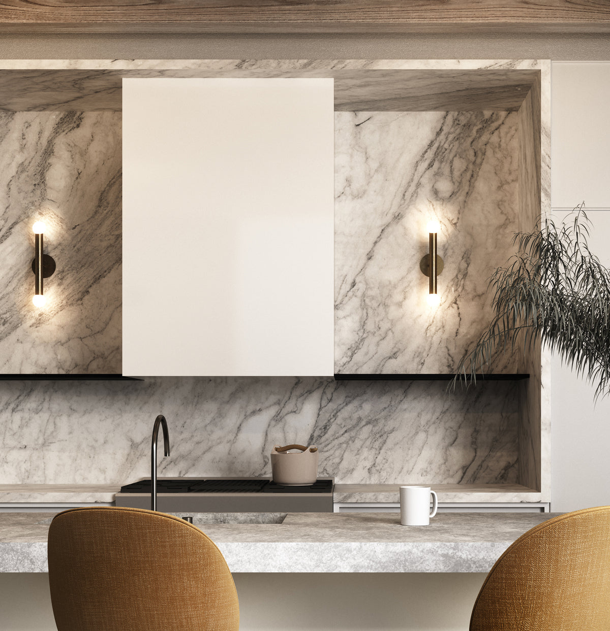 Modern kitchen with white marble backsplash and countertop, minimalist white cabinets, sink, potted plant, mug, stove pot, and a Long Made Co. Miro 2 - 12" Sconce in brass. Two mustard-colored chairs sit in the foreground.